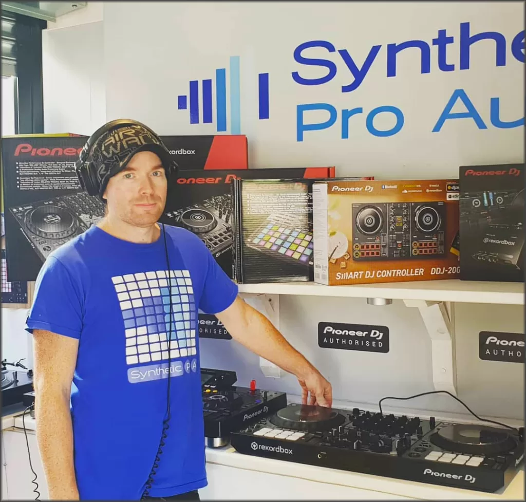Damian at Synthetic Pro Audio Music store presenting pioneer DJ equipment.